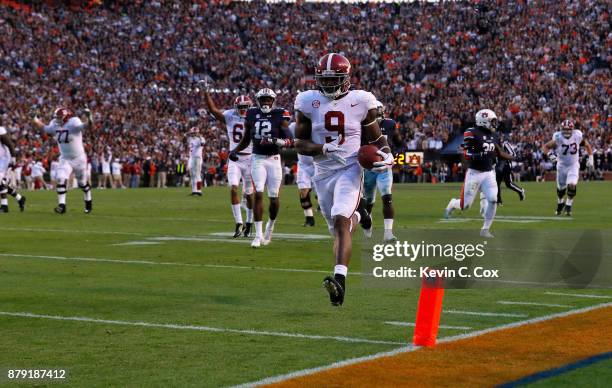 Bo Scarbrough of the Alabama Crimson Tide rushes for a touchdown during the third quarter against the Auburn Tigers at Jordan Hare Stadium on...