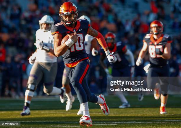 Cam Thomas of the Illinois Fighting Illini runs for a touchdown against the Northwestern Wildcats at Memorial Stadium on November 25, 2017 in...