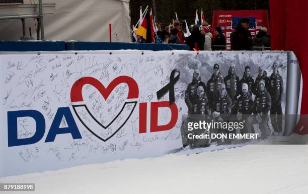 Banner hangs in the finish area, signed by racers, in memory of French skier David Poisson during the FIS Ski World Cup Men's Downhill on November 25...