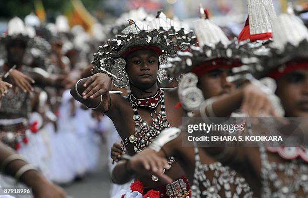 Traditional Sri Lankan Kandyan dancers perform at a state-sponsored festival to commemorate the defeat of the Tamil Tiger rebels in Colombo on May...