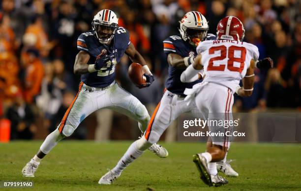 Kerryon Johnson of the Auburn Tigers carries the ball during the fourth quarter against the Alabama Crimson Tide at Jordan Hare Stadium on November...