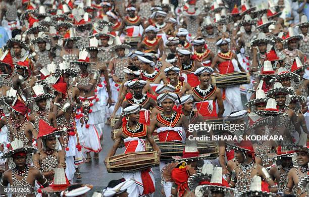 Traditional Sri Lankan Kandyan dancers perform at a state-sponsored festival to commemorate the defeat of the Tamil Tiger rebels in Colombo on May...
