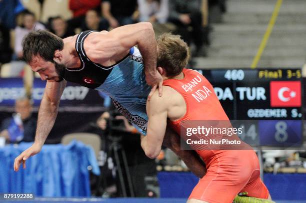 Moldovas Mihail Esanu competes with Turkeys Sedat Ozdemir during the Senior U23 Wrestling World Championships in the 61 kg class on November 25, 2017...