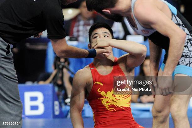 Chinas Wanhao Zou competes with Turkeys Suleyman Atli during the Senior U23 Wrestling World Championships in the 57 kg class on November 25, 2017 in...