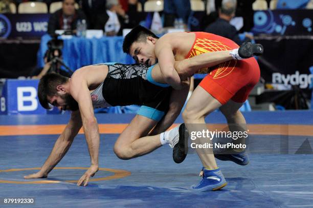 Chinas Wanhao Zou competes with Turkeys Suleyman Atli during the Senior U23 Wrestling World Championships in the 57 kg class on November 25, 2017 in...