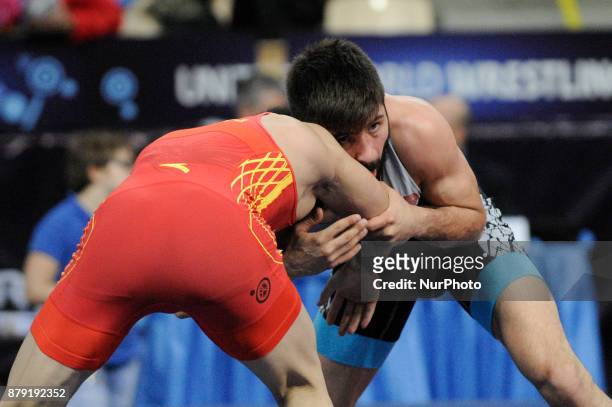 Chinas Wanhao Zou competes with Turkeys Suleyman Atli during the Senior U23 Wrestling World Championships in the 57 kg class on November 25, 2017 in...