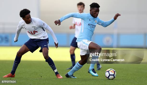 Shayon Harrison of Tottenham Hotspur and Tom Dele-Bashiru of Manchester City during the Premier League 2 at The Academy Stadium on November 25, 2017...