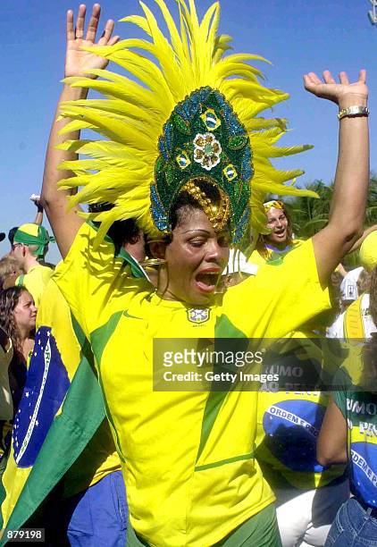 Fan of the Brazilian soccer team celebrates after winning the World Cup finals match against Germany June 30, 2002 in Rio de Janeiro, Brazil. Brazil...
