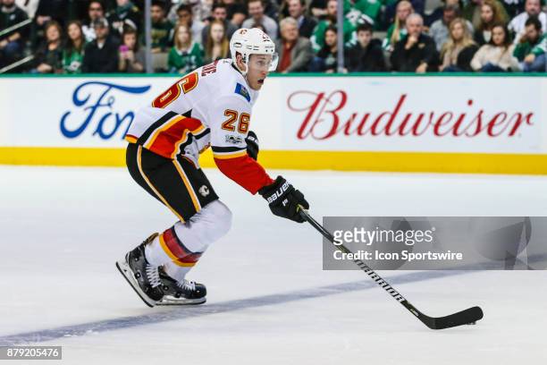 Calgary Flames defenseman Michael Stone skates up the ice with the puck during the game between the Dallas Stars and the Calgary Flames on November...
