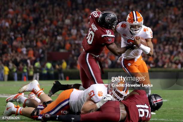 Skai Moore of the South Carolina Gamecocks tries to stop Kelly Bryant of the Clemson Tigers during their game at Williams-Brice Stadium on November...