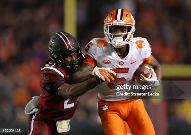 Jamyest Williams of the South Carolina Gamecocks tackles Tee Higgins of the Clemson Tigers during their game at Williams-Brice Stadium on November...