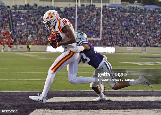 Wide receiver Hakeem Butler of the Iowa State Cyclones catches a touchdown pass against defensive back Cre Moore of the Kansas State Wildcats during...