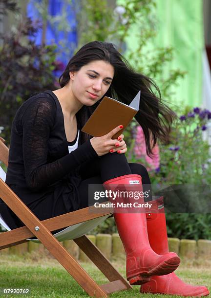 Festival-goers use the Reader from Sony during the Guardian Hay Festival on May 22 2009 in Hay-on-Wye, England. Sony, a new sponsor of the Guardian...
