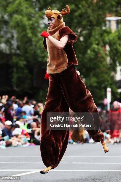 Performer takes part in the annual Farmers Santa Parade on November 26, 2017 in Auckland, New Zealand. The Farmers Santa Parade has brought joy to...