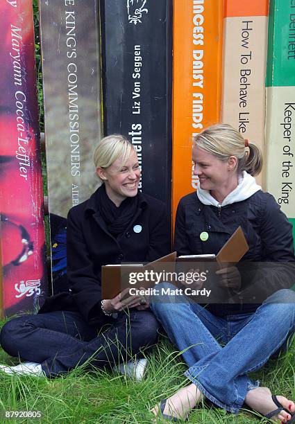 Festival-goers use the Reader from Sony during the Guardian Hay Festival on May 22 2009 in Hay-on-Wye, England. Sony, a new sponsor of the Guardian...