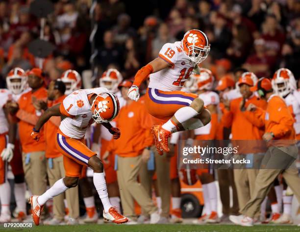 Teammates Trevion Thompson and Tanner Muse of the Clemson Tigers react after a play against the South Carolina Gamecocks during their game at...