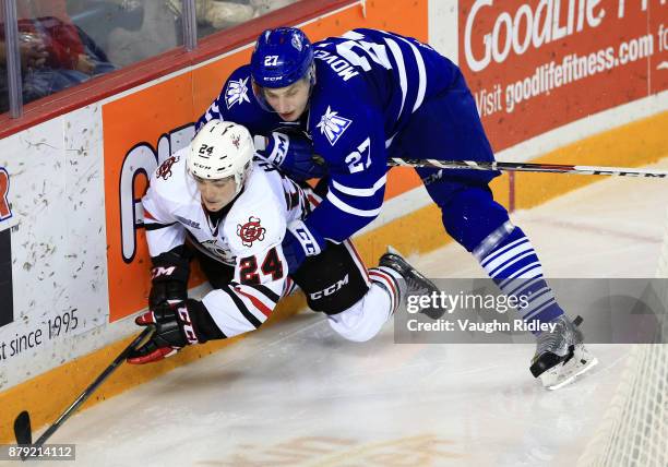 Jacob Moverare of the Mississauga Steelheads battles with Liam Ham of the Niagara IceDogs during the second period of an OHL game at the Meridian...