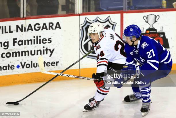 Jacob Moverare of the Mississauga Steelheads battles with Liam Ham of the Niagara IceDogs during the second period of an OHL game at the Meridian...