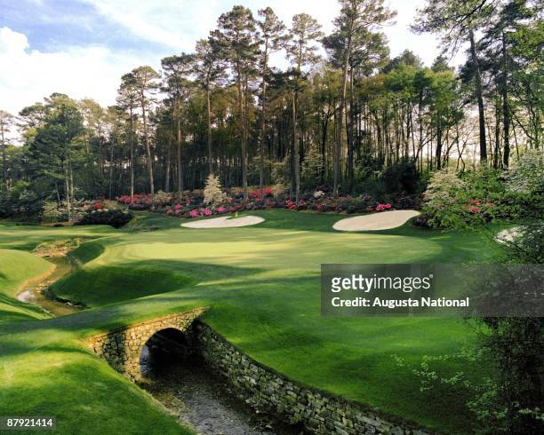 The 13th green with bridge in foreground during the 1980's Masters Tournament at Augusta National Golf Club in Augusta, Georgia.