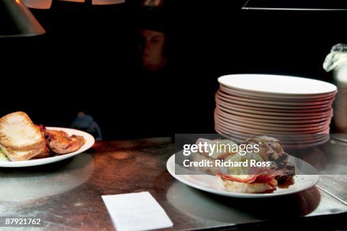 A Chef Serving Eggs Benedict A Chef Serving Eggs Benedict