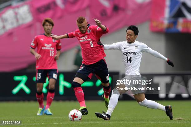 Souza of Cerezo Osaka and Naoyuki Fujita of Vissel Kobe compete for the ball during the J.League J1 match between Cerezo Osaka and Vissel Kobe at...