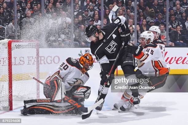 Drew Doughty of the Los Angeles Kings shoots the puck against Ryan Miller of the Anaheim Ducks at STAPLES Center on November 25, 2017 in Los Angeles,...