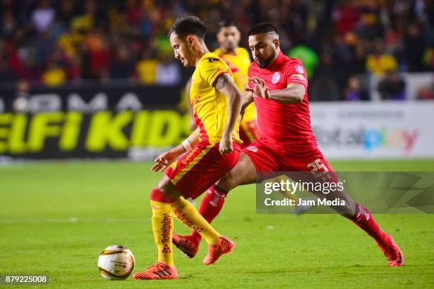 Carlos Guzman of Morelia and Pedro Canelo of Tolucafight for the ball during the quarter finals second leg match between Morelia and Toluca as part...