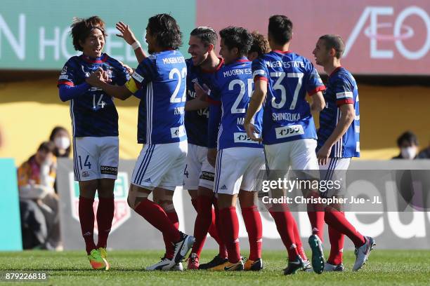 Jun Amano of Yokohama F.Marinos celebrates scoring the opening goal with his team mates during the J.League J1 match between Vegalta Sendai and...
