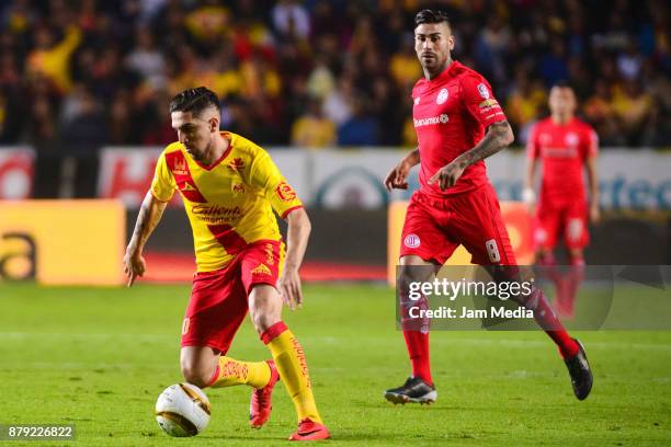 Diego Valdes of Morelia and Jesus Mendez of Toluca fight for the ball during the quarter finals second leg match between Morelia and Toluca as part...