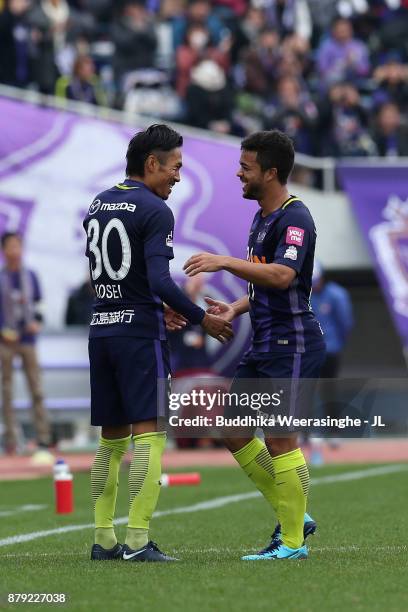 Kosei Shibasaki of Sanfrecce Hiroshima celebrates scoring the opening goal with his team mate Felipe Silva during the J.League J1 match between...