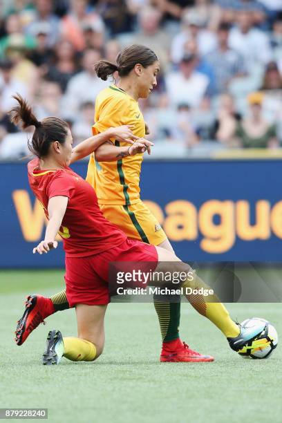 Sam Kerr of the Matildas is tackled by Wu Haiyan of China PR during the Women's International match between the Australian Matildas and China PR at...