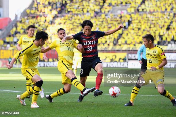 Mu Kanazaki of Kashima Antlers controls the ball under pressure of Kashiwa Reysol defense during the J.League J1 match between Kashima Antlers and...
