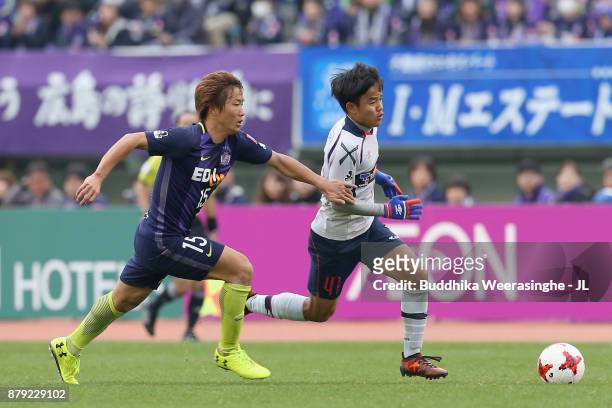 Takefusa Kubo of FC Tokyo and Sho Inagaki of Sanfrecce Hiroshima compete for the ball during the J.League J1 match between Sanfrecce Hiroshima and FC...
