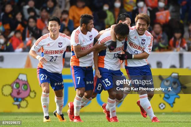 Masaru Kato of Albirex Niigata celebrates scoring his side's second goal with his team mates during the J.League J1 match between Shimizu S-Pulse and...