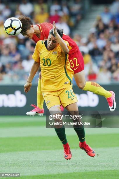 Ma Jun of China PR heads the ball over Sam Kerr of the Matildas during the Women's International match between the Australian Matildas and China PR...