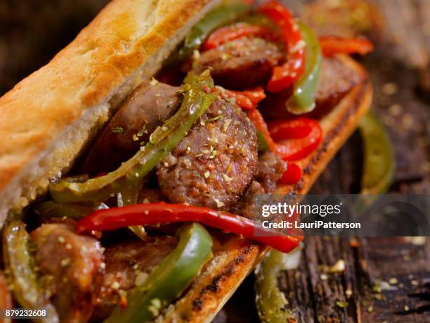 grilled sausage and peppers sandwich - grilled baguette stock pictures, royalty-free photos & images