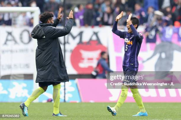 Patric and Kazuhiko Chiba of Sanfrecce Hiroshima celebrate their 2-1 victory and avoided the relegation after the J.League J1 match between Sanfrecce...