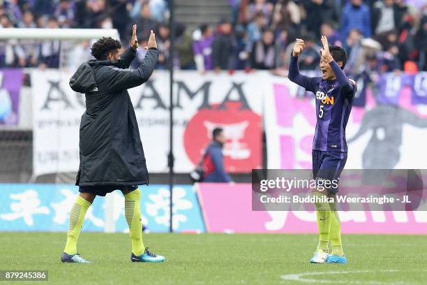 Patric and Kazuhiko Chiba of Sanfrecce Hiroshima celebrate their 2-1 victory and avoided the relegation after the J.League J1 match between Sanfrecce...