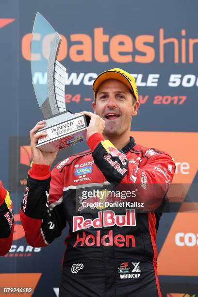 Jamie Whincup driver of the Red Bull Holden Racing Team Holden Commodore VF celebrates after winning race 26 and the 2017 Supercars Drivers...