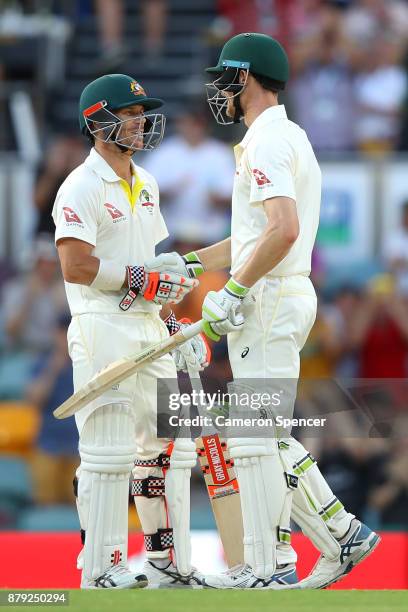 David Warner of Australia congratulates team mate Cameron Bancroft after reaching his half century during day four of the First Test Match of the...