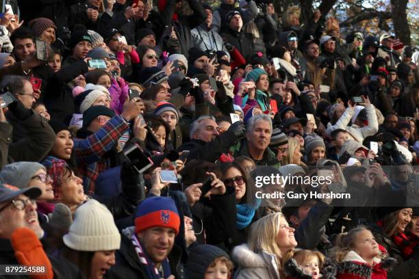 People photograph a balloon as it floats down Central Park West during the annual Thanksgiving Day Parade on November 23, 2017 in New York City. The...