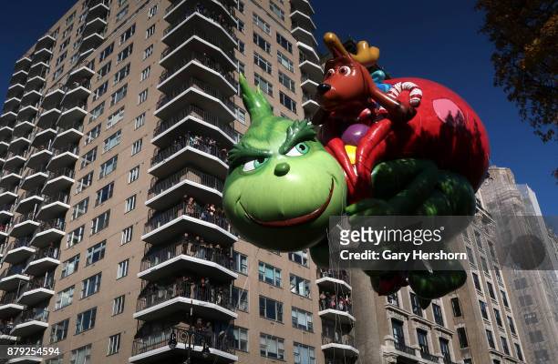 The Grinch balloon floats down Central Park West during the annual Thanksgiving Day Parade on November 23, 2017 in New York City. The Macy's...
