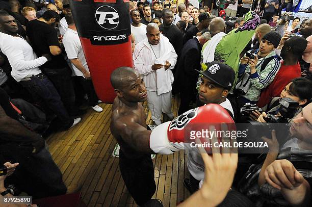 Boxer Floyd Mayweather greets fans during a promotional training session and media opportunity at the Peacock boxing gym, Canning Town, in London on...