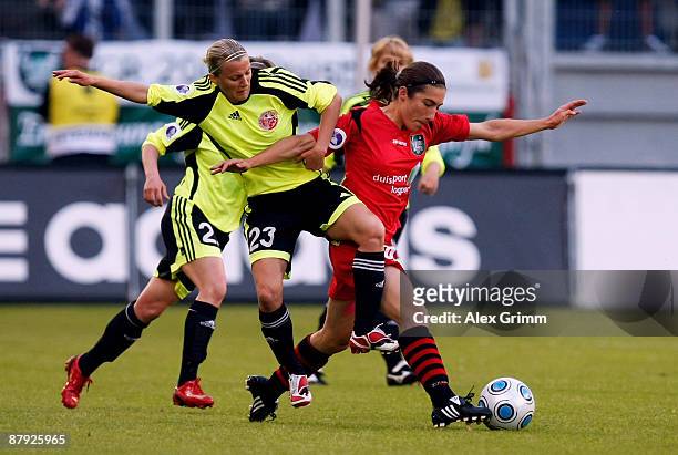 Very Dyatel of Perm challenges Annemieke Kiesel-Griffioen of Duisburg during the UEFA Women's Cup Final second leg match between FCR Duisburg and...