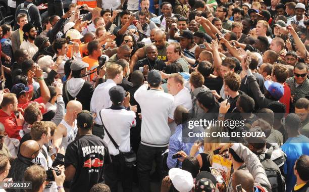 Boxer Floyd Mayweather is mobbed by fans as he arrives for a promotional training session and media opportunity at the Peacock boxing gym, Canning...