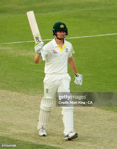 Cameron Bancroft of Australia celebrates and acknowledges the crowd after scoring a half century during day four of the First Test Match of the...