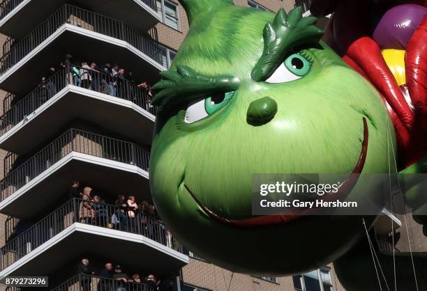 The Grinch balloon floats down Central Park West during the annual Thanksgiving Day Parade on November 23, 2017 in New York City.