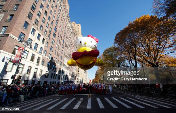 The Hello Kitty balloon floats down Central Park West during the annual Thanksgiving Day Parade on November 23, 2017 in New York City.