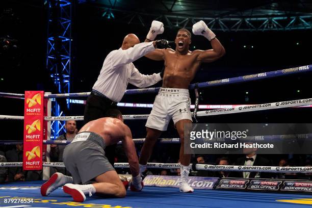 Anthony Joshua celebrates knocking down Wladimir Klitschko in the 5th round during the IBF, WBA and IBO Heavyweight World Title bout at Wembley...