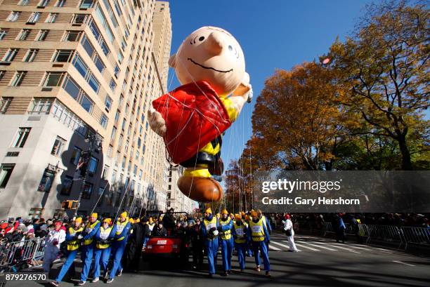 The Charlie Brown balloon floats down Central Park West during the annual Thanksgiving Day Parade on November 23, 2017 in New York City.